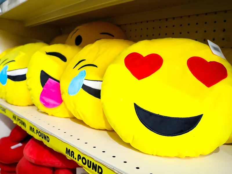 Emoji cushions on a Mr. Pound shelf